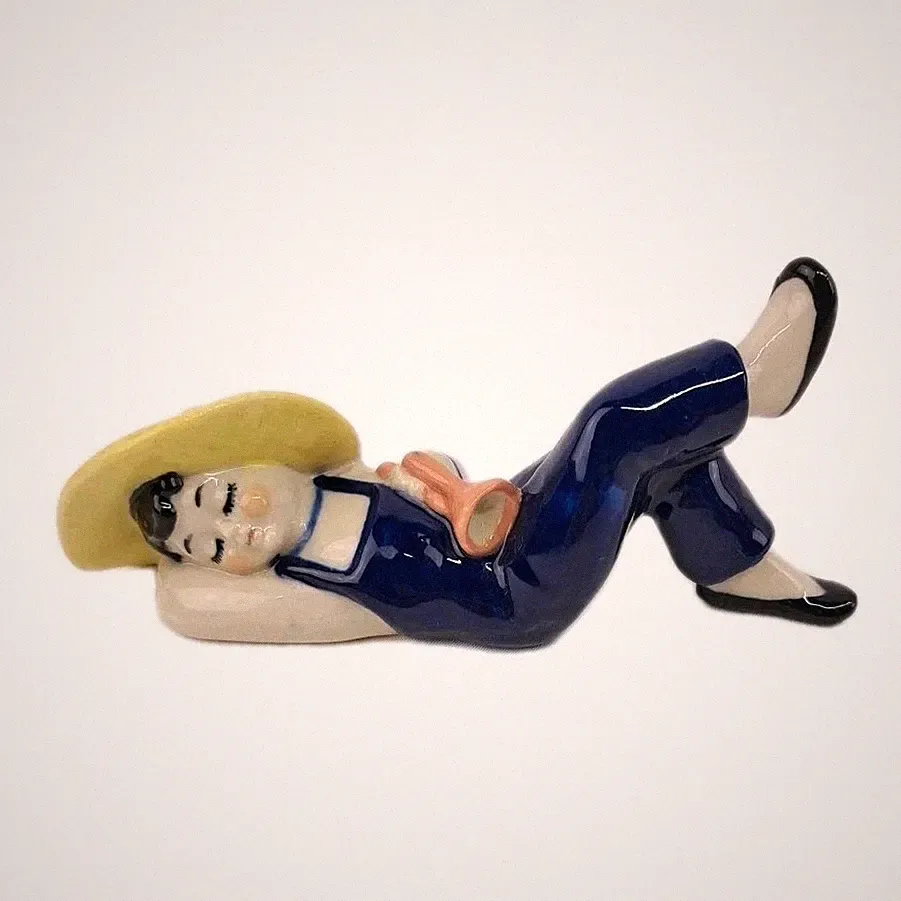 Vintage Folk Art Reclining Man Ceramic Figurine